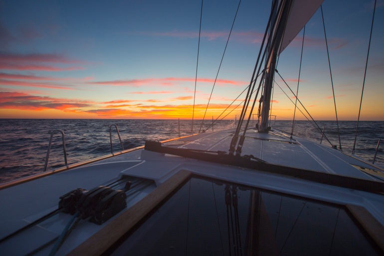 Sunrise sailing offshore from Miami to Bimini, Bahamas on the Jeanneau 509.