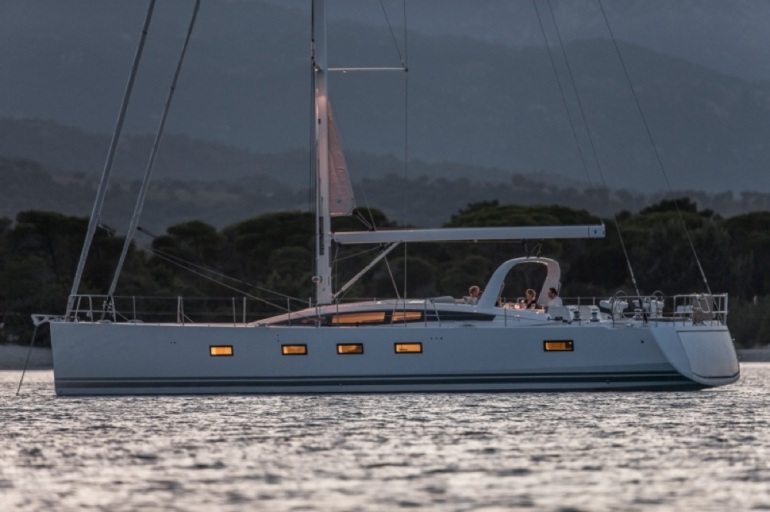 With the light just starting to fade, the Jeanneau 64 sits quietly at anchor off the coast of Corsica